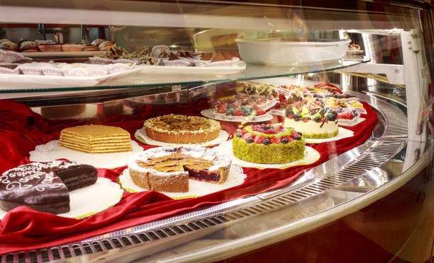istock Different colorful Tasty beautiful cakes on a show-window in caf 1059277568