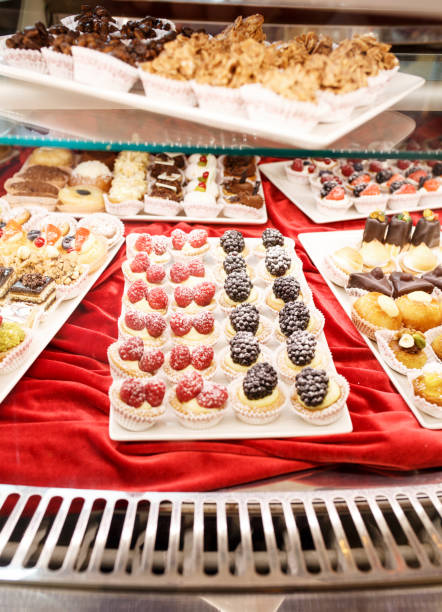 istock Different colorful Tasty beautiful cakes on a show-window in caf 1059277614