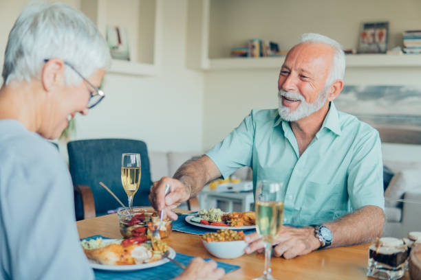 istock Joyful old couple eating lunch 1059286274