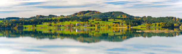 istock panoramic scene in Bavaria with mountains mirroring in lake 1059289130