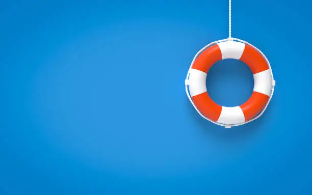 Photo of Life Buoy On Blue Background