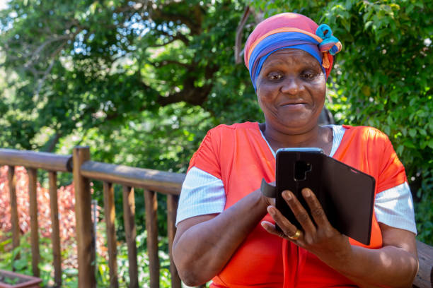 istock African woman looking at her cellphone. 1059290904