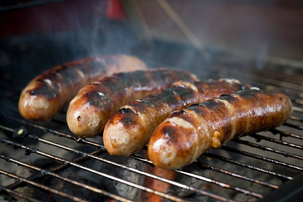 istock Four Bratwursts on a Grill 105929252