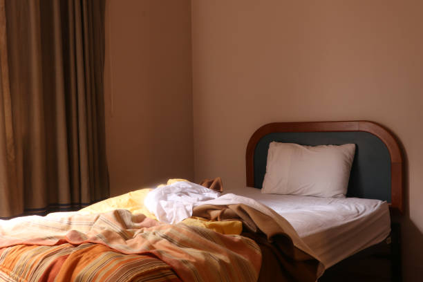 istock unmade bed in the morning 1059293810