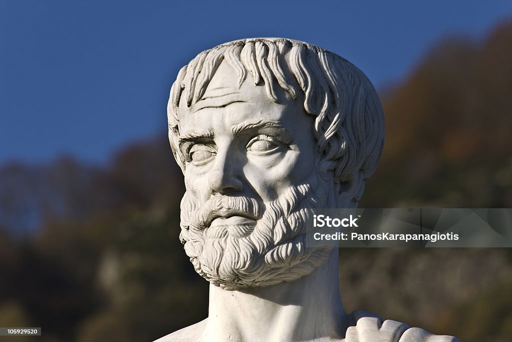 Portrait of a stones statue of Aristotle on a sunny day Aristotle statue located at Stageira of Greece (birthplace of the philosopher) Aristotle Stock Photo