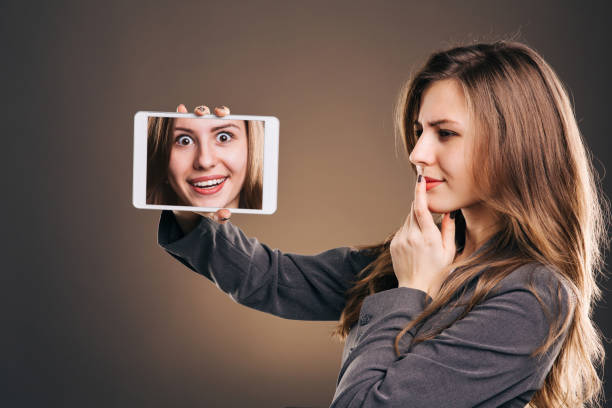 istock Woman showing selfie on tablet 1059296338