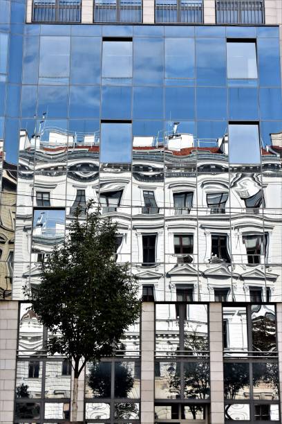 istock reflection of an old house in an office building 1059298254
