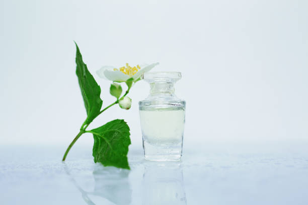 istock small perfume and delicate flower on a white background 1059301882