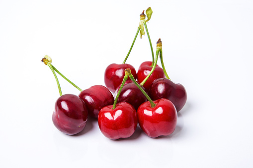 Beautiful red fresh cherries on white background. Organic fruits concepts.