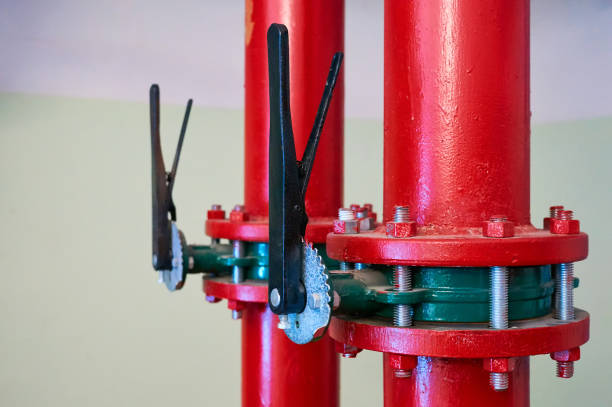 istock Valves installed on tubes painted red. Industrial background. 1059302054