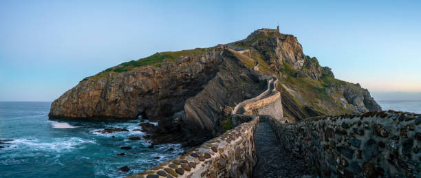 istock Gaztelugatxe hermitage panoramic view under the light of the moo 1059304390