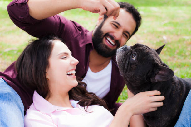 istock Couple in the park with their pet 1059306144