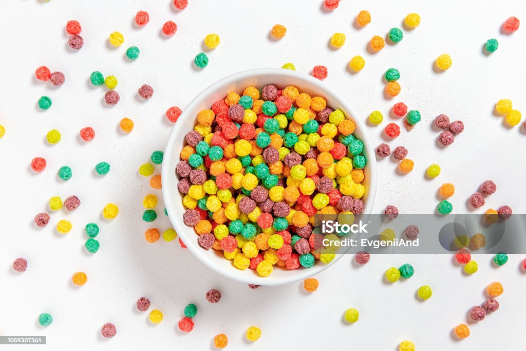 bowl of colorful cereal balls on white background breakfast food. flat lay, top view Breakfast Cereal Stock Photo