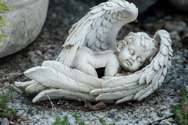 istock stoned angel on tomb in cemetery 1059308778
