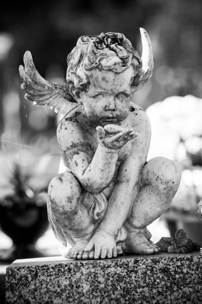 istock stoned angel on tomb in cemetery 1059308800