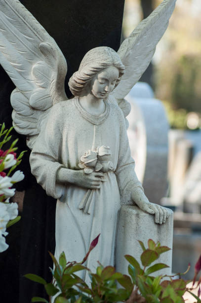 istock stoned angel on tomb in cemetery 1059308838