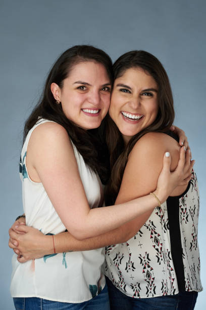istock Two happy smiling latino girls 1059312360