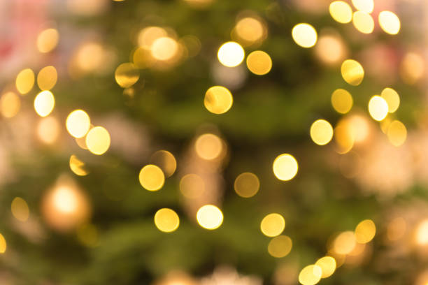 istock blurred golden green lights background 1059315298