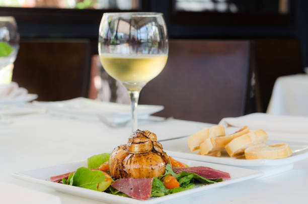 Burrata Mozzarella cheese salad accompanied by Prosciutto and Arugula