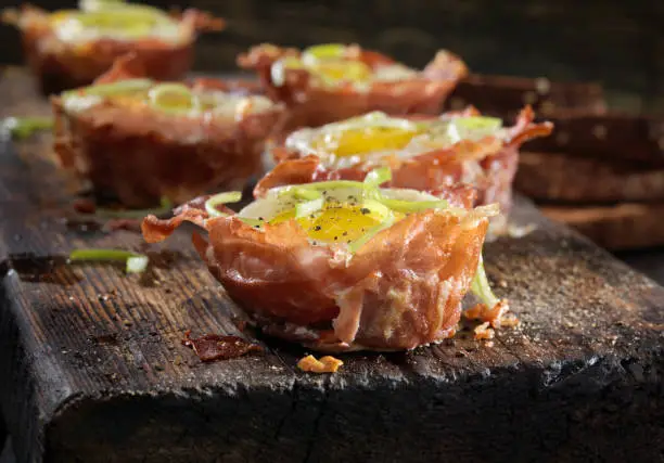Prosciutto and Cheese Eggcups with Cracked Pepper and Green Onions