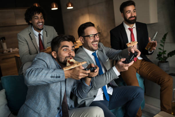 istock A group of young business man playing video games after work 1059321554