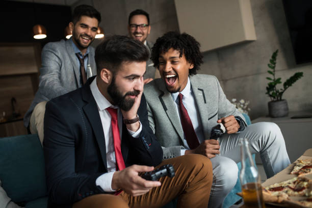istock A group of young business man playing video games after work 1059321850