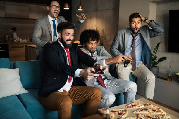 istock A group of young business man playing video games after work 1059321866