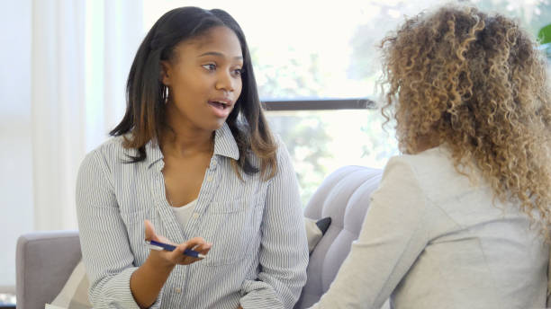 istock Young therapist speaks with unrecognizable patient 1059325846