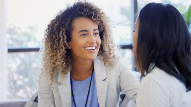 Cheerful counselor listens attentively to patient