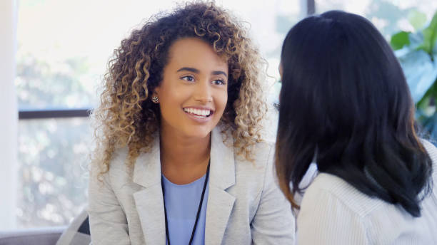 istock Young counselor enjoys speaking with patient 1059325872