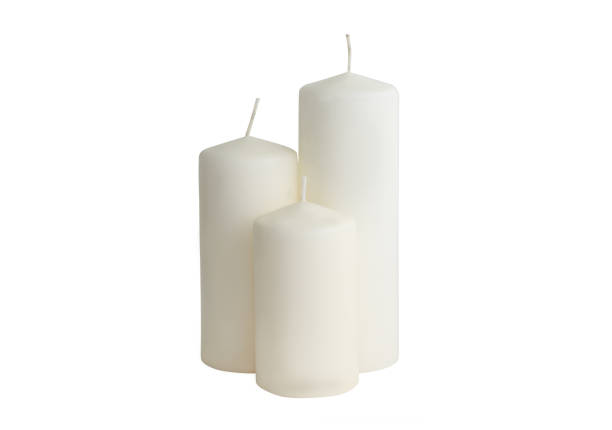 istock White candle on white background isolated. Wax candle 1059325988