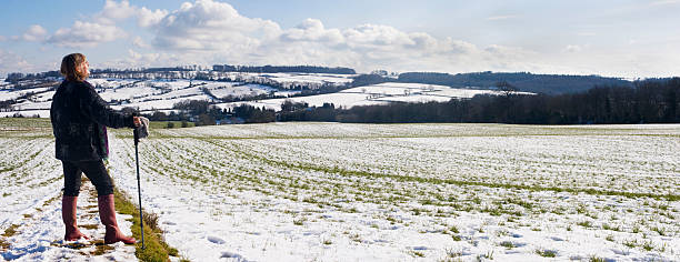 Woman Out For A Walk In The Snow stock photo