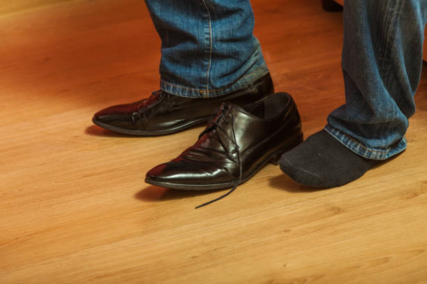 istock Man wearing black elegant shoes 1059329002