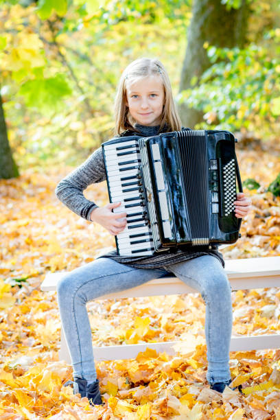 istock Young girl playing an accordeon 1059329380