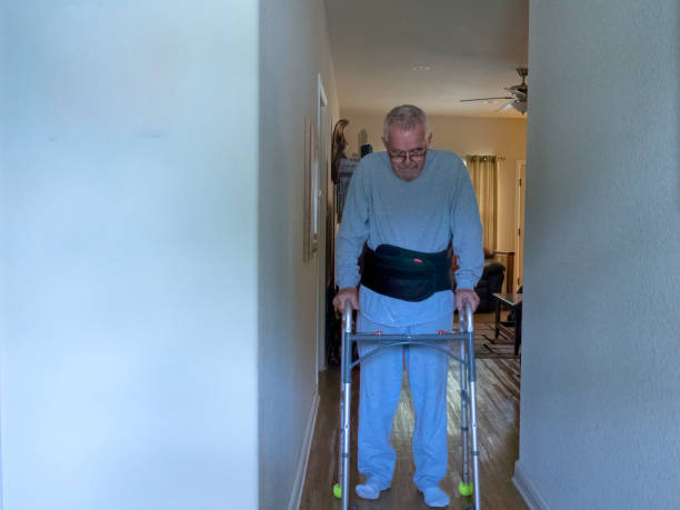 istock Man with Walker & Spinal Brace 1059329860
