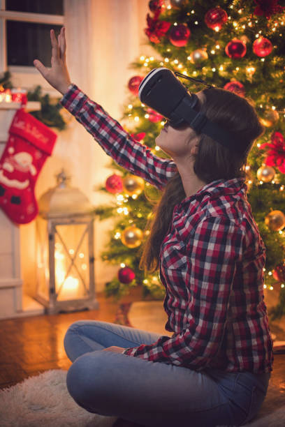 istock Teenage Girl Using Virtual Reality Simulator on Christmas 1059331792