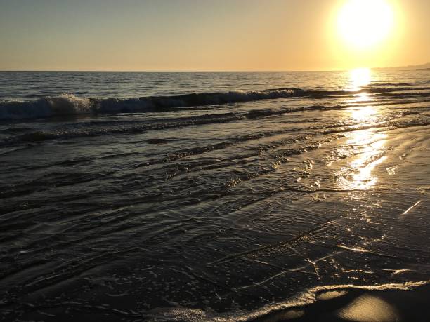 istock Sun on rippled sand and sea 1059332254