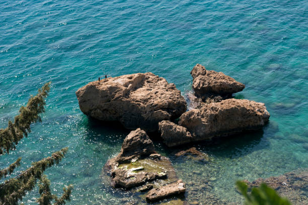 istock Rocks in the sea from top view. 1059332792