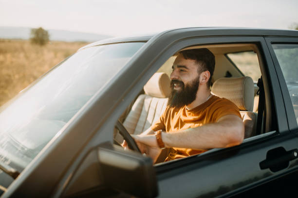 istock Young man traveling by car 1059334910
