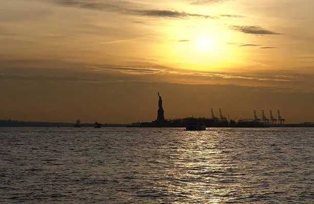 Photo of Statue of Liberty and sundown