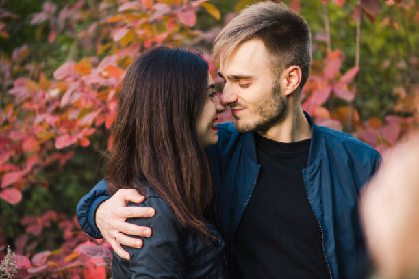 istock Happy young couple hugging at autumn forest 1059344046