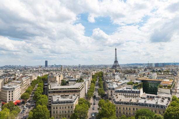 istock Eiffel Tower through Arc De Triomphe's observation desk during summertime 1059347248