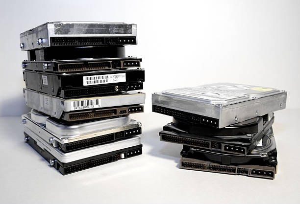 istock Pile of various hard drives on a white background 105934912