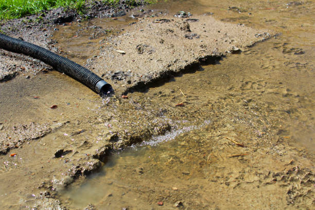 istock Water flowing out of a discharge hose 1059355632