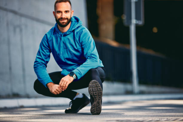 istock Man stretching on the street. 1059358112