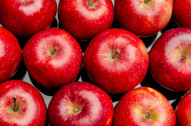 istock red apples on a black acrylic mirror 1059363020