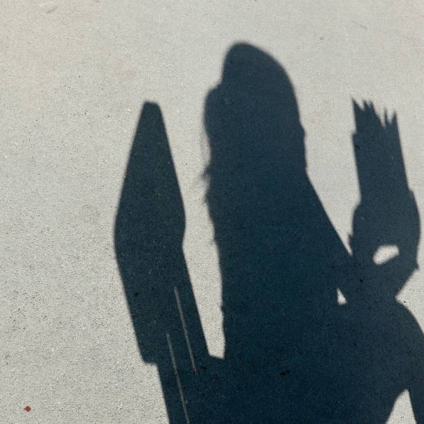 istock Expressive Shadows of girl on wall 1059365742
