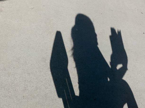 istock Expressive Shadows of girl on wall 1059365746