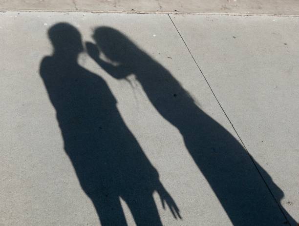 istock Expressive Shadows of girl on wall 1059365764