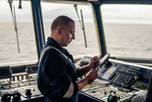 istock Marine navigational officer or chief mate on navigation watch 1059367146